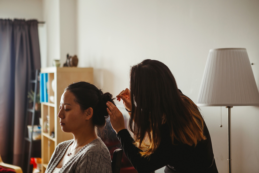bride having her hair done at home by the make up artist and fashion designer Kelly and heading to vieux port steakhouse for her winter intimate wedding