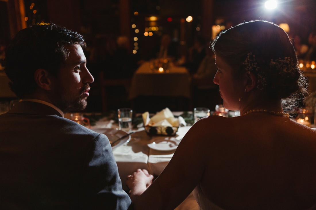 bride and groom holding hands during reception in edgewater lodge,