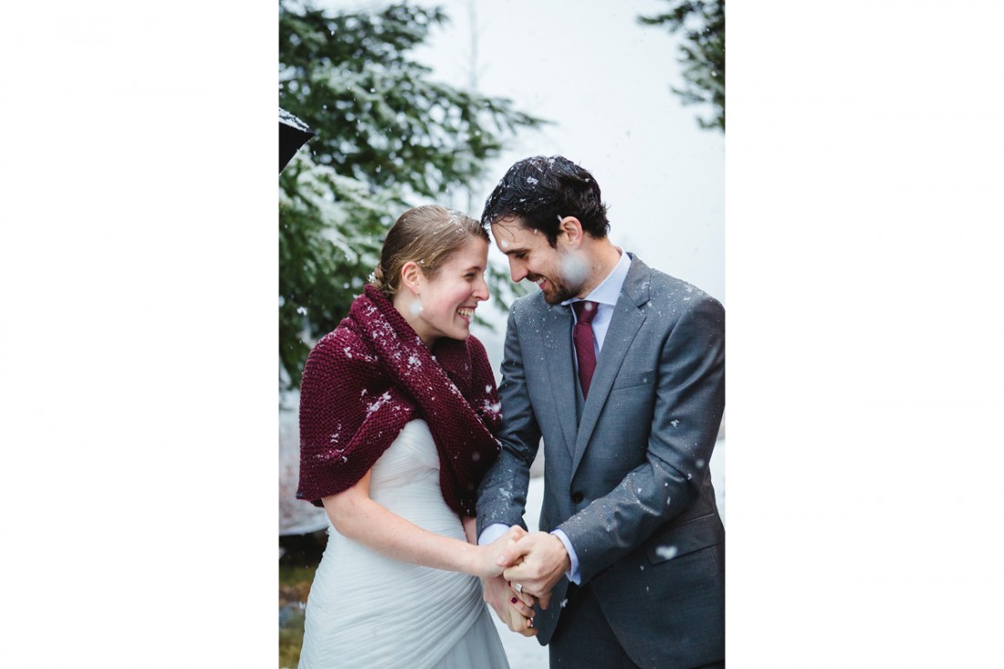 bride and groom walk down the aisle happily touching foreheads and holding hands