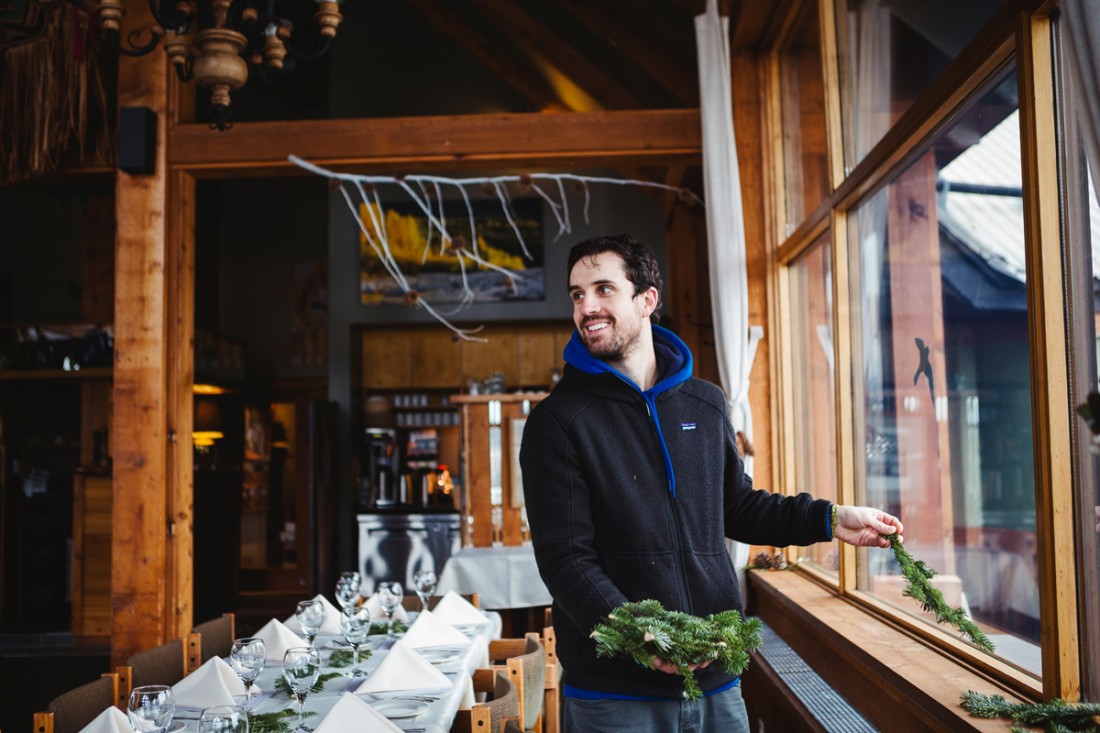 groom helping to decorate the reception hall with the pine nuts she collected during the summer in vancouver stanley park