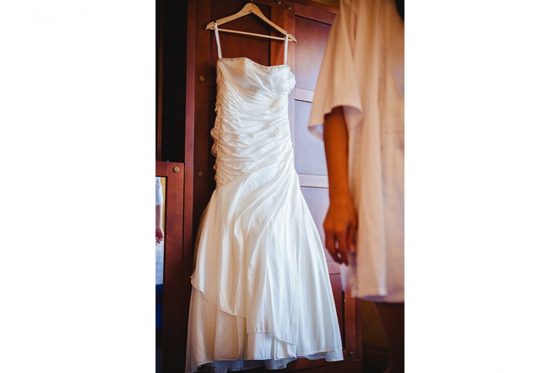 Wedding dress hanging in the luxor hotel roomto get ready for Amy and Ken's destination wedding